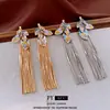 Pendientes Vintage de Aguja Plateada con Borlas y Hojas Tachonadas de Diamantes, Estilo de Mediados de Siglo, Pendientes de Botón Versátiles de Moda de Lujo Ligero con un Diseño Único