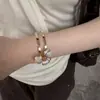 Pulsera, Anillo y Conjunto de Joyas Elegantes Estilo Francés de Lujo Ligero con Flor de Lirio para Mujeres con un Temperamento Moderno, de Alta Gama y Exquisito