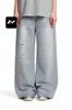 Jeans boca de sino estiloso e versátil em estilo retrô rasgado para homens e mulheres, casual e moderno, com efeito emagrecedor e design até o chão