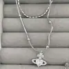 Collar de plata rota con amor Saturno de circón microincrustado para mujer, doble cadena apilada en la clavícula, cadena para suéter de lujo ligero de alta gama para mujer