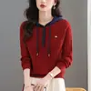2026 Ropa de punto con capucha de color contrastante Otoño e Invierno Nuevo estilo Sudadera con retazos y hebilla para mujer Holgada Adelgazante Moda Versátil Suéter