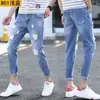 Jeans rasgados para hombre, pantalones pitillo ajustados, marca de moda, pantalones cortos, estilo delgado de verano, versión coreana, pantalones desgastados