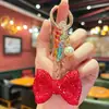 Llavero de Moño Elegante y de Alta Gama Incrustado con Diamantes y Exquisitas Cuentas de Cristal de Colores, un Accesorio Decorativo para Bolsos de Mujer