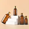 Shuncode en stock 5-100ml botella sub-botella mezcladora de vidrio botella de esencia cosmética 15ml Botella de aceite esencial marrón