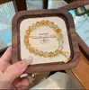 Pulseira de Cristal Torre Amarela Natural para Mulheres, Design de Nicho de Luxo Leve, Pingente de Cabacinha da Sorte, Joia de Pulseira de Contas de Alta Qualidade