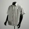 Camisa Listrada Bege de Manga Curta Nova Chegada de Verão da Fábrica Masculina Solta Versátil Tendência Marca Meia Manga Casual Camisa Masculina