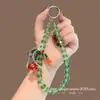 Cadena de Teléfono Popular de Cuentas de Cristal de Colores Bolso Corto de Muñeca Llavero Anti-Pérdida Funda de Teléfono para Mujer Correa