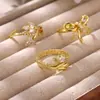 Anillo abierto de serpiente con lazo microincrustado de circonita, de lujo ligero europeo y americano, elegante y versátil, en stock para venta al por mayor
