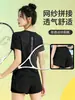 Top de corrida feminino com bolso com zíper para guardar o celular, manga curta em malha respirável de verão, camiseta esportiva de secagem rápida