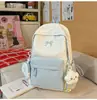 Nova mochila fofa para meninas, versátil e estilosa, com designs de estrelas e laços, adequada para estudantes do ensino fundamental II, ensino médio e universitários, perfeita para a escola