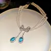 Colar e Brincos em Formato de Borboleta de Cristal Azul com Laço de Pérola e Zircônia em Camada Dupla, Corrente de Clavícula de Alto Padrão Estilo Palácio para Mulheres