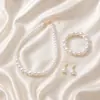 Collar Pulsera Pendientes de Perla de Imitación de Venta Caliente Transfronteriza Juego de Tres Piezas Diseño de Nicho Pulsera Cadena Clavícula Pendientes para Mujer