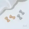 Cuentas Espaciadoras de Cobre Chapado en Oro de 14 Quilates con Forma de Lazo y Agujero Pasante para Accesorios de Pulseras de Cristal y Perlas DIY