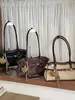 Bolso de mano vintage de alta gama transfronterizo para mujer, nuevo modelo otoño 2026, bolso versátil casual para hombro y axila para el trabajo