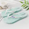 Zapatillas de masaje con flores, zapatos de mujer, chanclas de verano nuevas, sandalias de playa planas de color sólido a la moda para mujer, venta al por mayor de marea