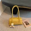 Bolsa de almohada de color sólido retro estilo coreano, bolsa de mano tipo bowling única, nueva bolsa de hombro simple de alta moda para 2026