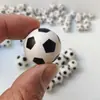 Máquina de pinball giratoria de goma elástica, venta al por mayor de fábrica, pelota de fútbol giratoria, pelota de salto, juguetes pequeños de descompresión
