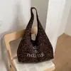 Bolsa tote de bolinhas estilo casual feminina 2026 nova de alta qualidade grande capacidade bolsa de ombro dupla face Yer Yu
