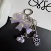 Nuevo colgante de lazo dulce corazón de cereza cadena de teléfono de hueso de serpiente llavero lindo accesorio para bolso