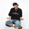 Camiseta de Manga Curta com Estampa de Leopardo e Letras Estilo Streetwear Americano para Homens e Mulheres Verão Tendência Marca Rogue Cool Solta Casual Gola Redonda Meia Manga