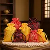 Bolsa pequeña para guardar joyas al por mayor de fábrica, bolsa de brocado, estilo chino vintage, bordado, bolsa con cordón para joyas