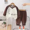 Conjunto de Ropa para Niños Primavera y Otoño 2025 Nuevo Elegante Sudadera para Bebé de Cuello Redondo y Pantalones de Manga Larga Conjunto de Dos Piezas Moderno