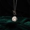 Collar giratorio de cara sonriente acero de titanio expresión giratoria hip hop estado de ánimo inverso artístico hombres y mujeres colgante de cara llorando joyería moderno nuevo