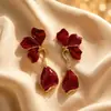 Aretes Geométricos Rojos Ankela Festivos de Año Nuevo Nicho Temperamento Venta Caliente Aretes de Botón Otoño/Invierno 2026 Venta al por Mayor de Pendientes
