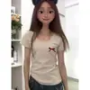 Camiseta Elegante Juvenil de Manga Corta Ajustada para Mujer Primavera y Verano 2026 Nuevo Modelo Gris Cuello Redondo Hombro Normal Top Estudiante