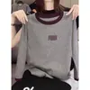 Camiseta de manga larga para mujer con cuello y puños de algodón puro en colores contrastantes, moderna y versátil, top rejuvenecedor, nuevo modelo otoño 2026