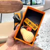 Colgante de peluche tejido a crochet cosas buenas suceden lana tejida a mano Caqui bueno Caqui suceden llavero para bolso accesorios pequeños