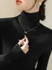 Elegante y sofisticado suéter de cuello alto verde oscuro con mangas largas, camisa base tejida para mujer A5455