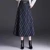 Falda de moda a cuadros para otoño e invierno, elegante falda de línea A de cintura alta para mujer, falda holgada y fluida de longitud media, nueva 2026