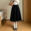 Versátil falda tipo gamuza para mujeres petite Nuevo estilo Otoño/Invierno 2026 Adelgazante Oculta Imperfecciones Oculta Barriga Longitud media Bolsillos Falda línea A