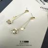 Pendientes de borla largos con estrellas distintivas de moda de Corea del Sur, pendientes de piedra de ojo de gato ligeros y elegantes de nicho para mujer
