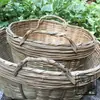 Cestas e pás de bambu, finamente tecidas à mão, usadas para armazenar grãos, para plantações de chá rurais, para colheita e secagem, e para uso festivo em novas casas