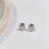 Aretes de Tuerca Geométricos de Estrella de Acero Titanio con Bolas de Acero Grandes y Pequeñas de Moda Simple al por Mayor de Fábrica de Venta Caliente Aretes Perforados Mujeres