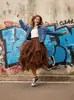Saia de tule feminina com design de cintura alta, feita de tule multicamadas, comprimento médio, estilo rock
