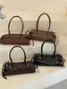 Bolso de hombro minimalista de nicho estilo coreano Shuai Mi Jia para mujer, nuevo modelo de moda otoño 2026, bolso baguette para debajo del brazo