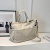 Bolsa de tela bolsa de mano de gran capacidad femenina 2023 nuevo otoño e invierno casual versátil bolsa de hombro estudiante clase bolsa grande