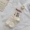 Meias cor terra femininas de cano médio na moda outono e inverno meias de pelúcia de desenho animado japonês meias-calças versáteis estilo artístico universitário