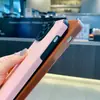 La nueva carcasa blanda de veta vertical es adecuada para iphone15promax dos colores ojos de ángel 14 cuatro esquinas 13 protección 12 juegos de 11 cuero