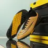 Zapatillas de fútbol de caña alta fábrica al por mayor para hombre y mujer adulto AG púas juvenil clavo roto profesional para partido de fútbol zapatilla deportiva