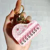 Nuevo Llavero de Mini Piano Transfronterizo Dibujo Animado Lindo Tocando el Piano Sanrio Juguete Musical Colgante Pequeño