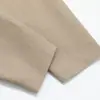 Vibe marca de moda americana color sólido holgado chaqueta abrigo temporada de primavera y otoño para hombre diseño de dobladillo plisado sentido de diseño estilo ropa de trabajo