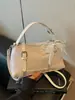 Nuevo bolso tejido de alta costura transfronterizo 2026, diseño elegante, bolso tote pequeño para salir, bolso de hombro y cruzado para mujer