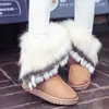 2026 Venta al por mayor del fabricante Botas de nieve de piel sintética de zorro y conejo de invierno Botas de media caña para mujer Zapatos cálidos Zapatos de algodón con borlas