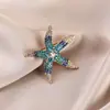 Broche de estilo antiguo nuevo de alta gama ins para mujer estilo chino abanico borla pin de traje cheongsam tapeta de presión corsage al por mayor