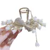 Pinza para el pelo de borla de pedrería de lirio del valle perlado, Pasador grande estilo hada de lujo ligero, Accesorio para el pelo de la celebridad de Internet con lazo, Accesorios para la cabeza al por mayor