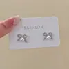 Pendientes de perlas con lazo elegantes de primavera para mujer, pendientes atmosféricos de sentido avanzado, pendientes únicos de lujo y nicho.